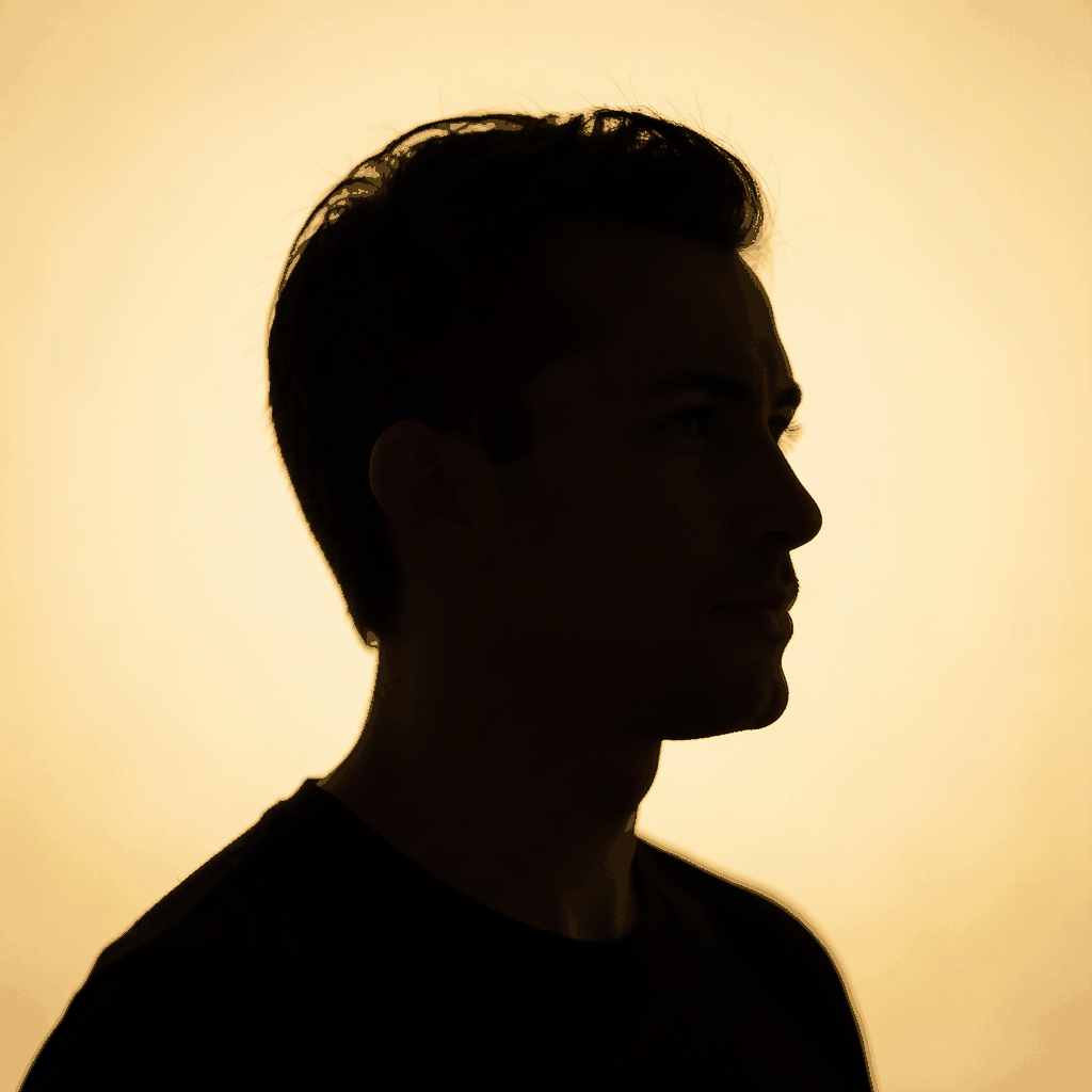 A warm, abstract portrait silhouette against a soft golden-yellow background, conveying a thoughtful and approachable mood.
